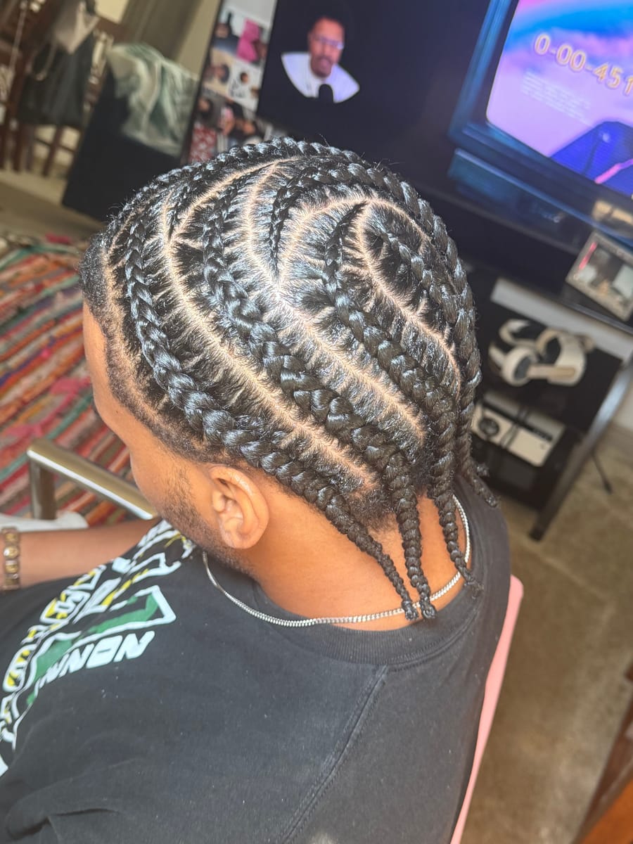 Curved cornrow braid design with clean parts, back view