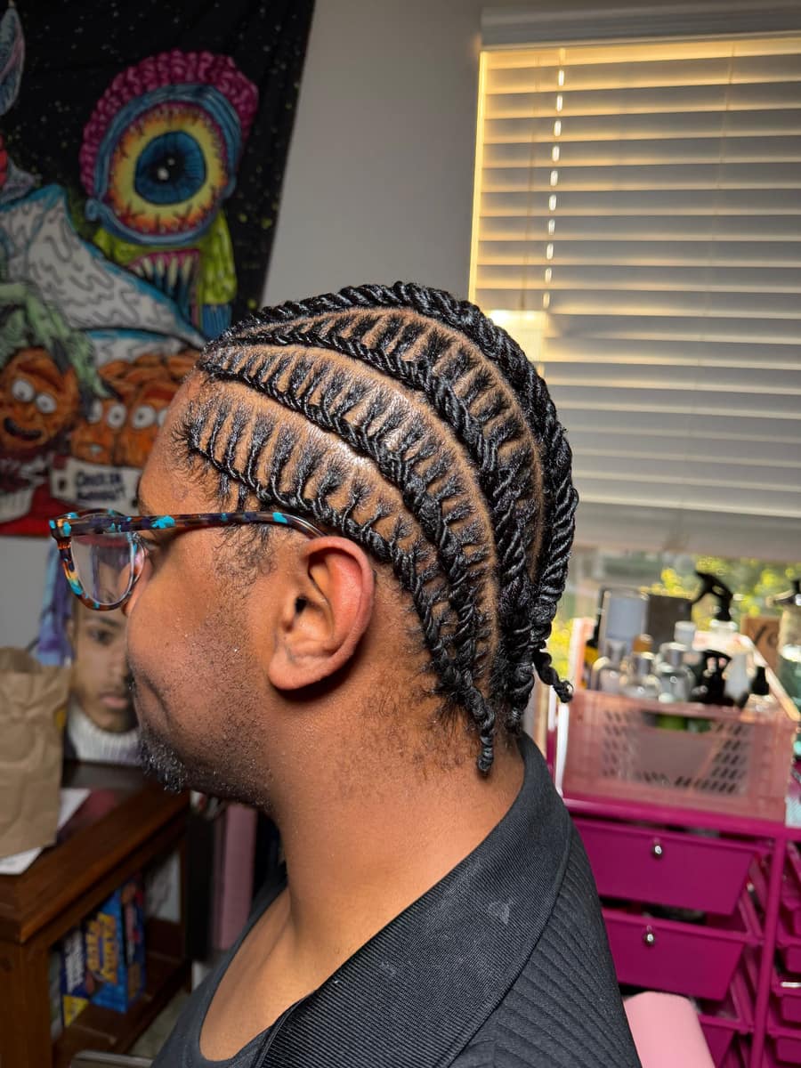 Twisted cornrows braided straight back, side profile