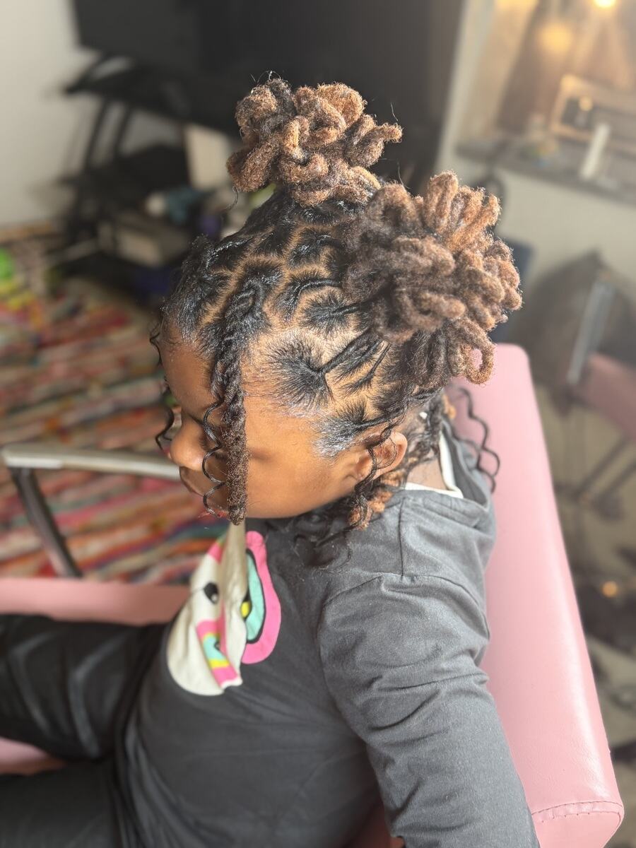 Child's loc updo with curled buns, side view